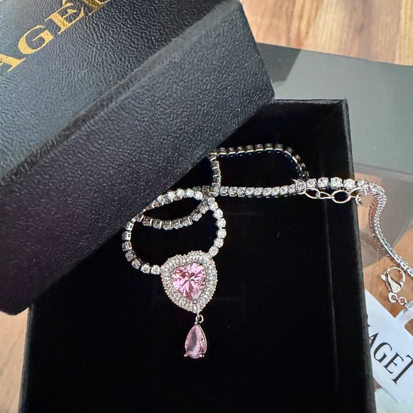 piajet Jewelry - Elegant silver-tone necklace with pink gemstones.